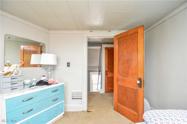 carpeted bedroom featuring ornamental molding