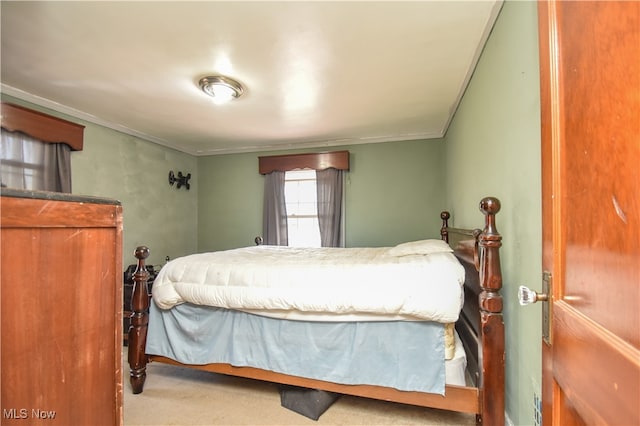 bedroom with carpet flooring and ornamental molding