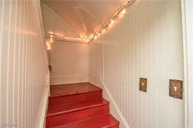 staircase with wooden walls