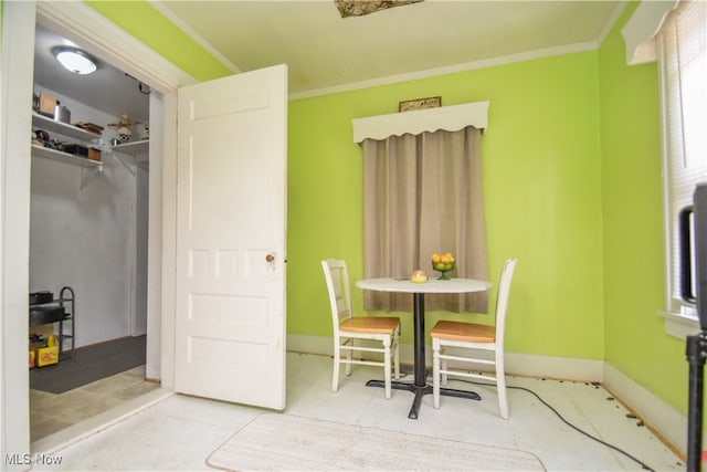 dining space featuring ornamental molding