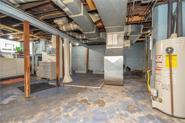 basement with washing machine and dryer and water heater