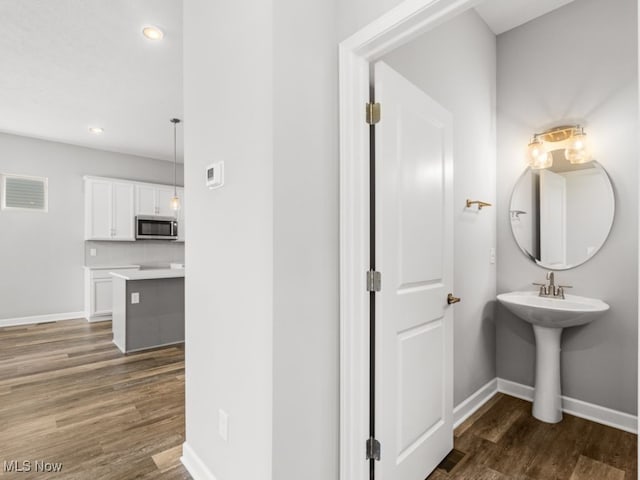 bathroom featuring hardwood / wood-style floors and sink