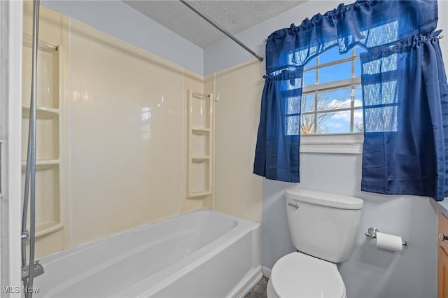 bathroom with shower / bathtub combination, toilet, and a textured ceiling