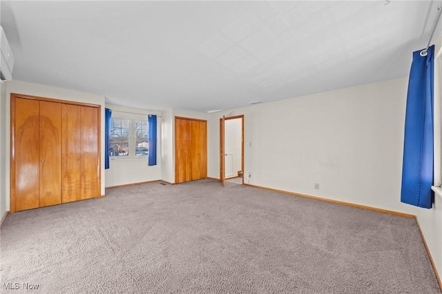 unfurnished bedroom with carpet and a closet