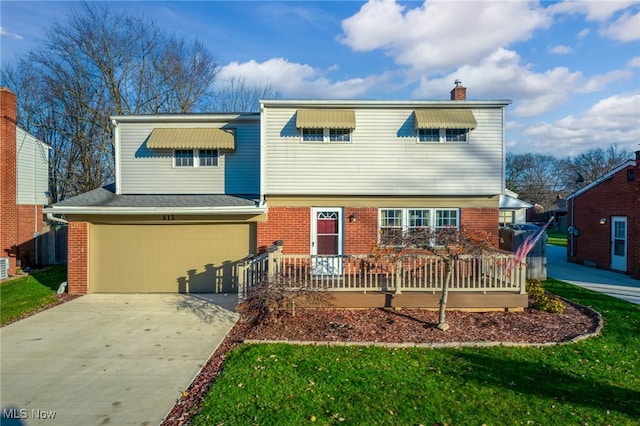 view of front facade with a front yard and a garage