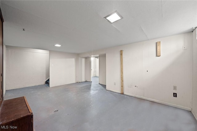 basement featuring a textured ceiling