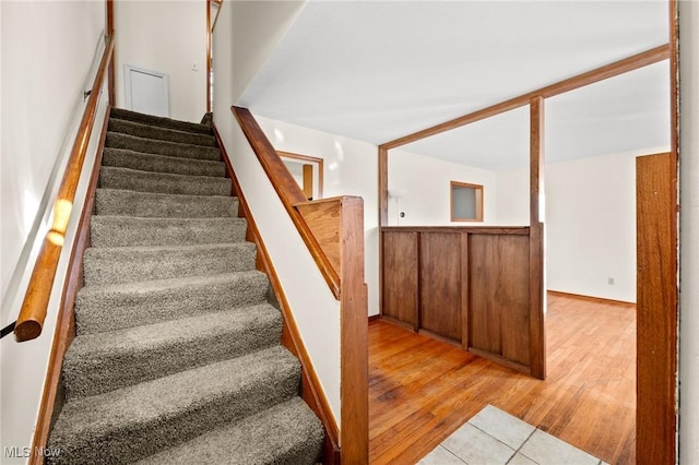 staircase featuring hardwood / wood-style flooring