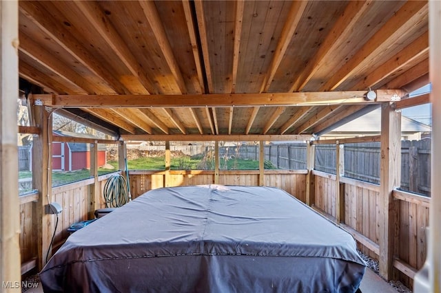 interior space featuring vaulted ceiling with beams and wooden ceiling