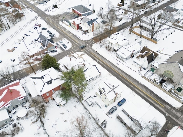 snowy aerial view featuring a residential view