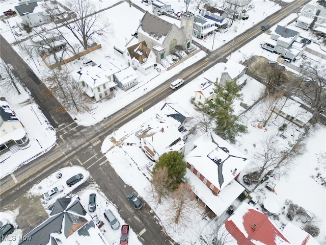 snowy aerial view featuring a residential view