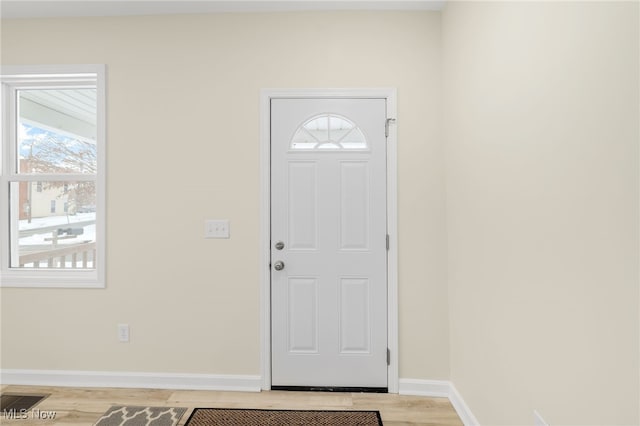 entryway with plenty of natural light and light hardwood / wood-style flooring