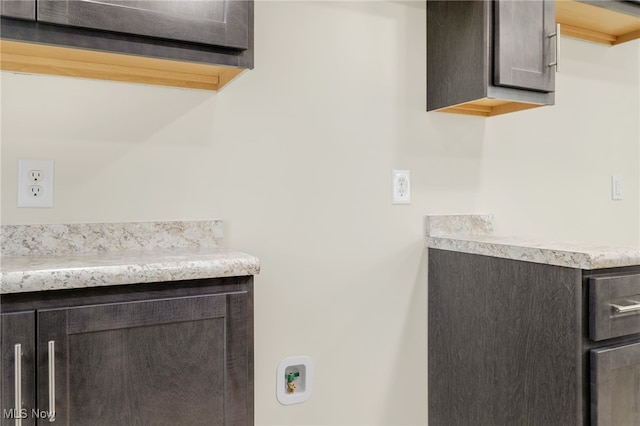 kitchen with dark brown cabinetry and light countertops