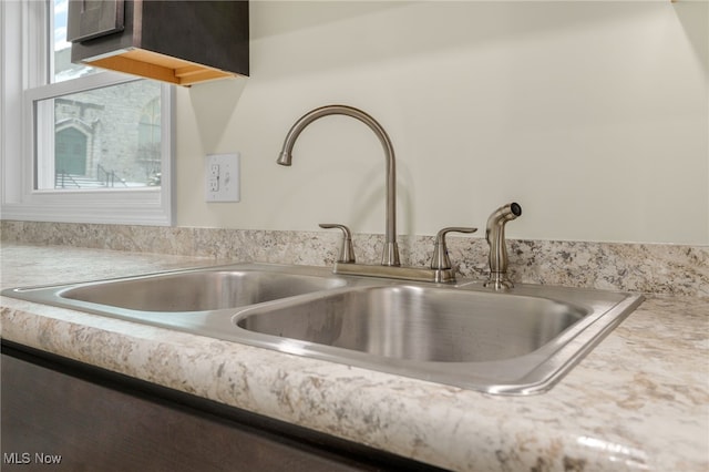 room details featuring light countertops and a sink