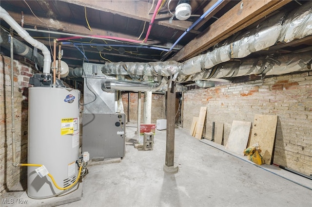 unfinished basement with heating unit, brick wall, and water heater