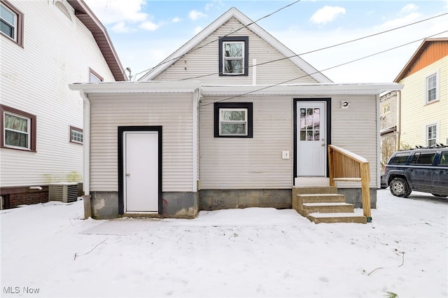 view of front of home featuring entry steps and central AC unit