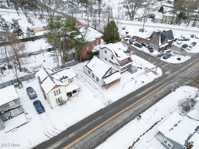 snowy aerial view with a residential view