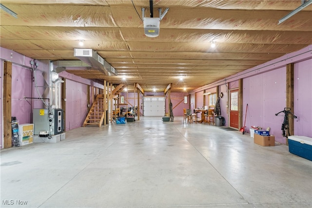 garage with heating unit and a garage door opener