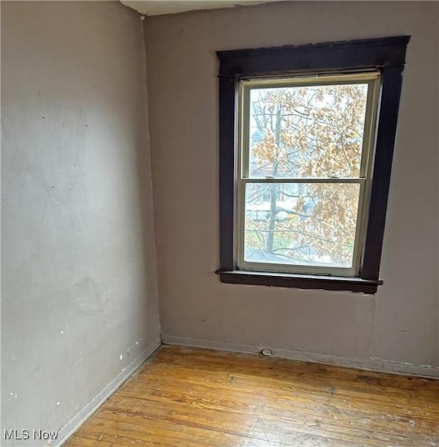 unfurnished room featuring light hardwood / wood-style floors