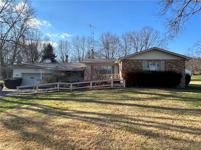 single story home with a garage and a front yard