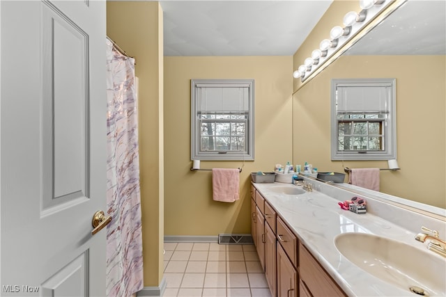 bathroom featuring tile patterned flooring and vanity