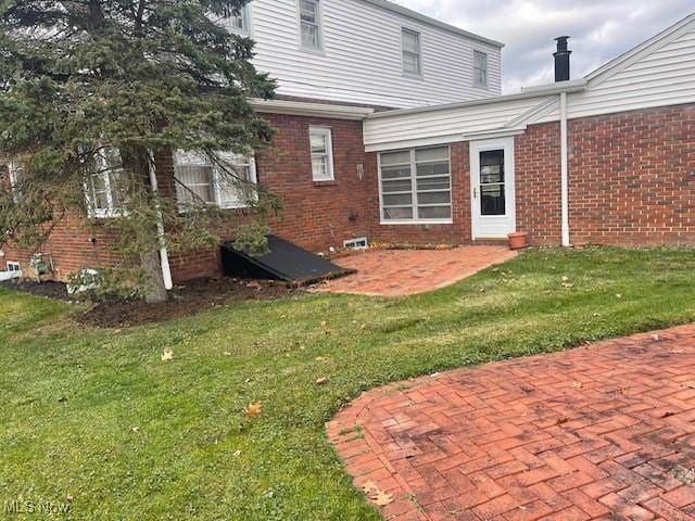 exterior space with a yard and a patio