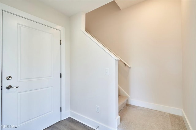 stairway featuring baseboards