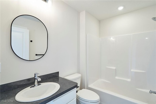 bathroom featuring toilet and vanity