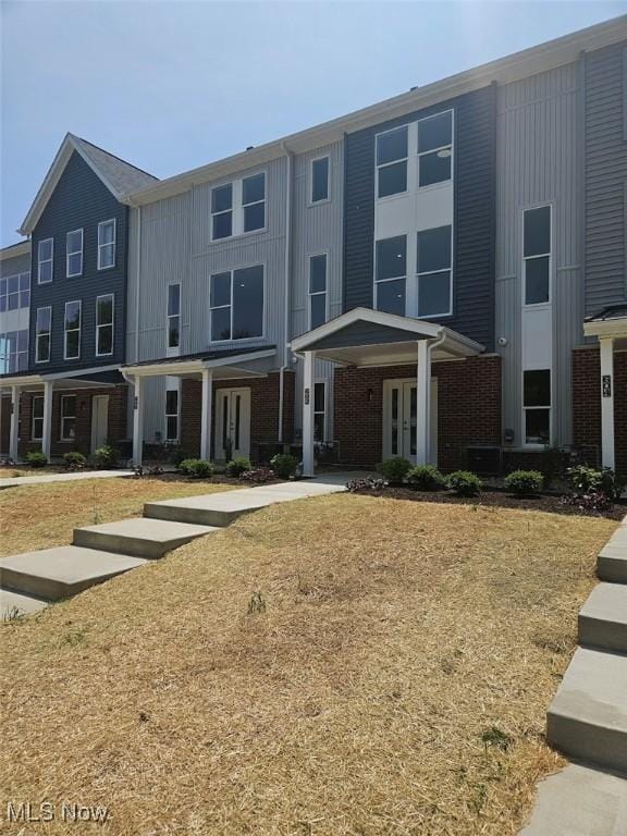 596 Mull Ave Unit 8, Akron, OH 44313 - multi unit property featuring french doors, brick siding, and board and batten siding