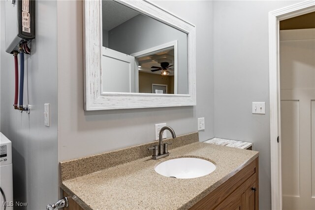 bathroom with vanity and ceiling fan