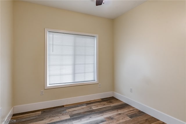 unfurnished room with hardwood / wood-style floors