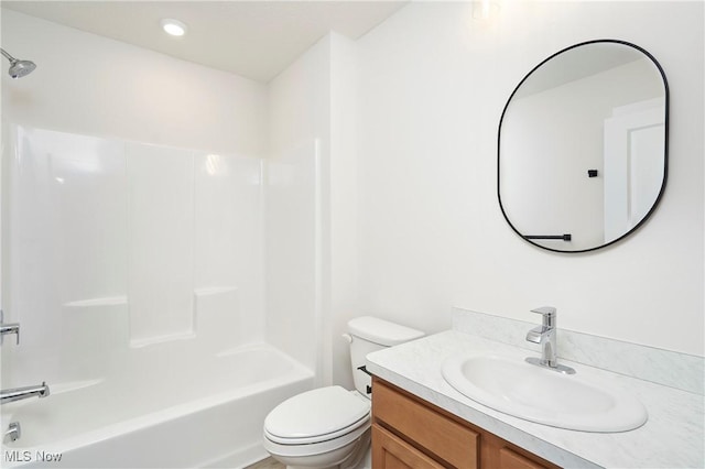 bathroom featuring recessed lighting, toilet,  shower combination, and vanity