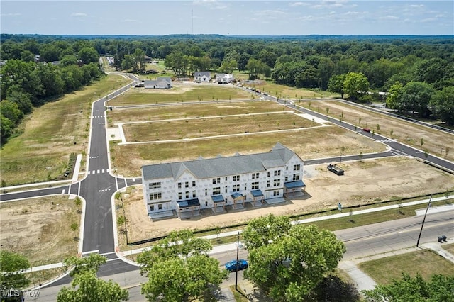 birds eye view of property featuring a rural view and a forest view