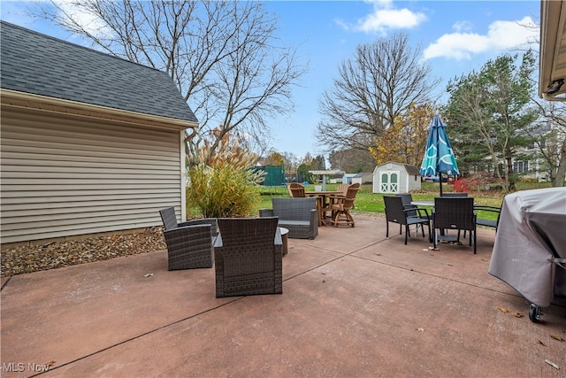 view of patio / terrace featuring a shed and grilling area