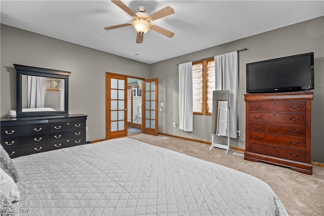 bedroom featuring light carpet, french doors, a textured ceiling, and ceiling fan