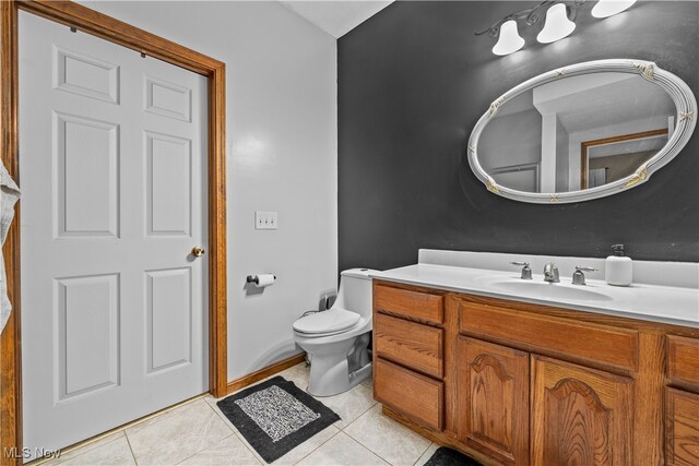 bathroom with tile patterned floors, vanity, and toilet