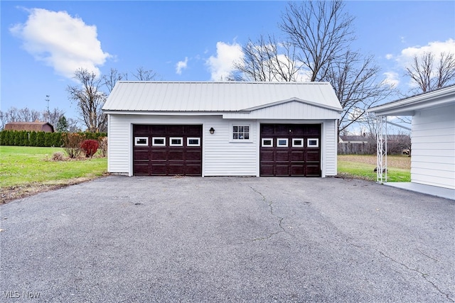 garage with a yard