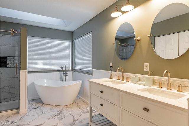 bathroom featuring vanity, separate shower and tub, and a skylight