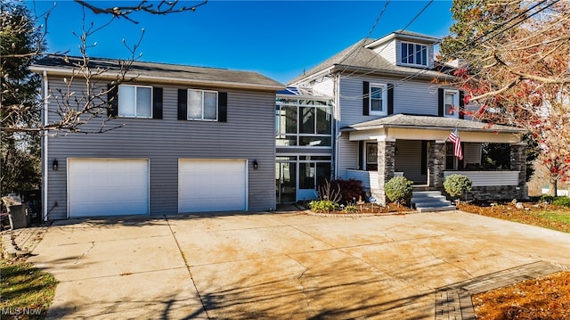 view of front of home with a porch and a garage