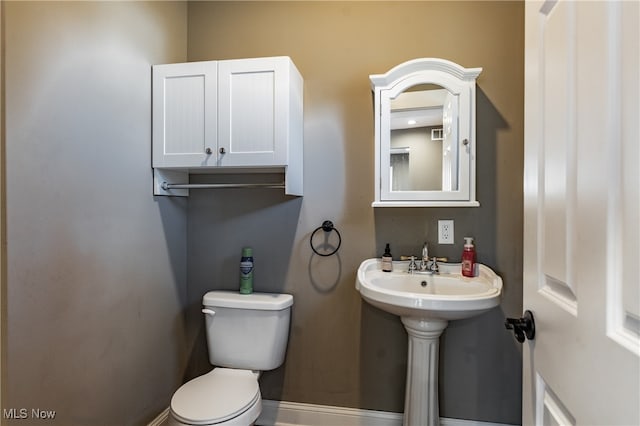 bathroom featuring toilet