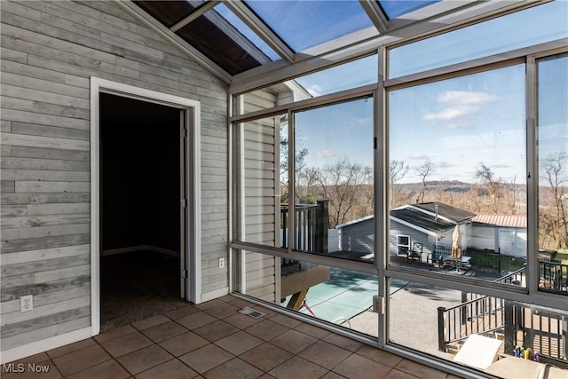 sunroom / solarium with lofted ceiling