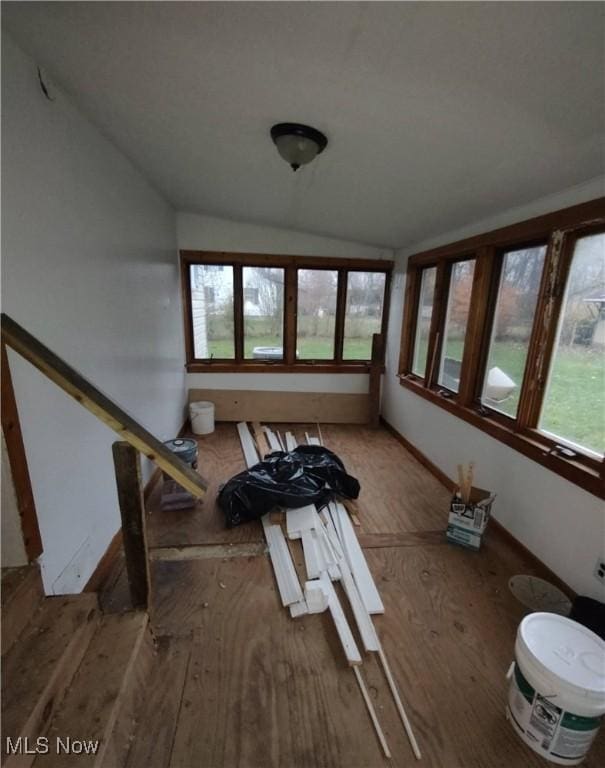 unfurnished sunroom with vaulted ceiling