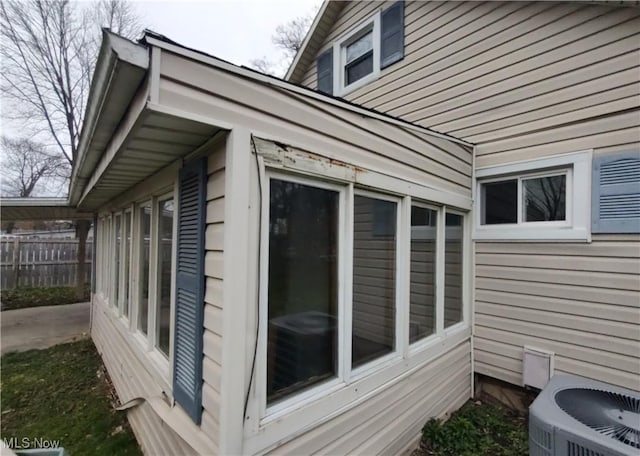 view of side of property with central AC unit