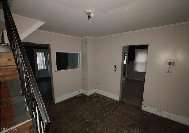 spare room featuring ornamental molding