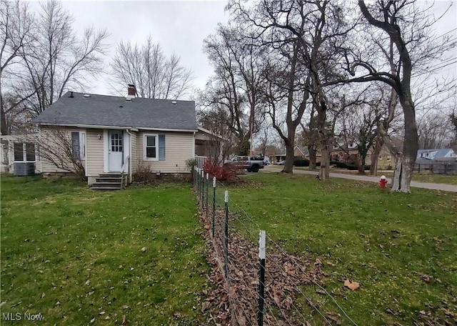 view of yard with central AC