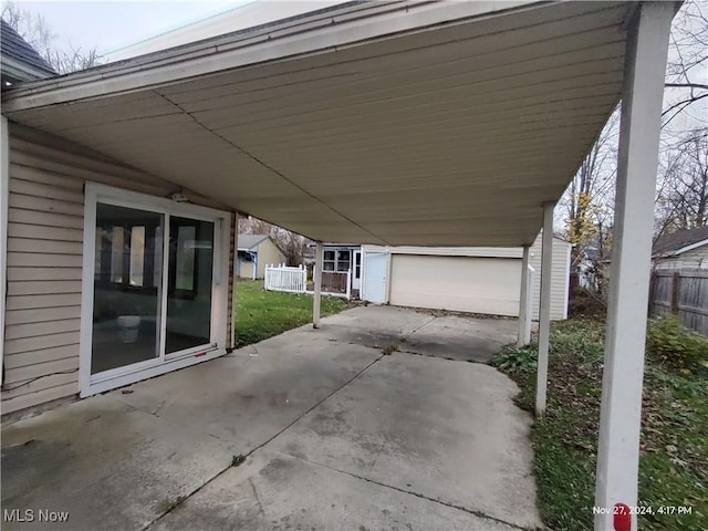 view of patio / terrace featuring a carport and a garage