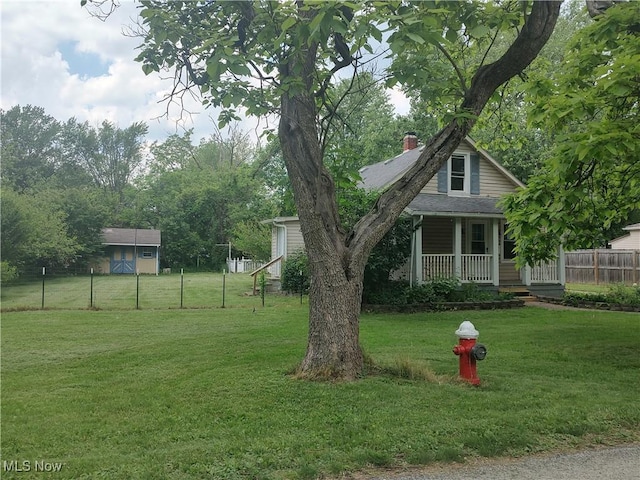 view of yard featuring covered porch