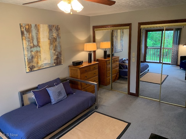 bedroom with ceiling fan, a textured ceiling, access to outside, a closet, and carpet