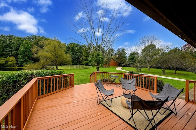 wooden terrace with a yard