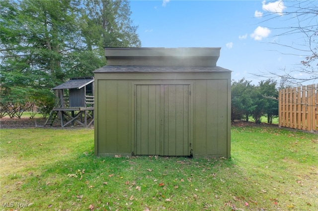 view of outdoor structure with a lawn