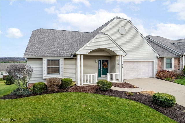 view of front of property featuring covered porch, a front yard, and a garage